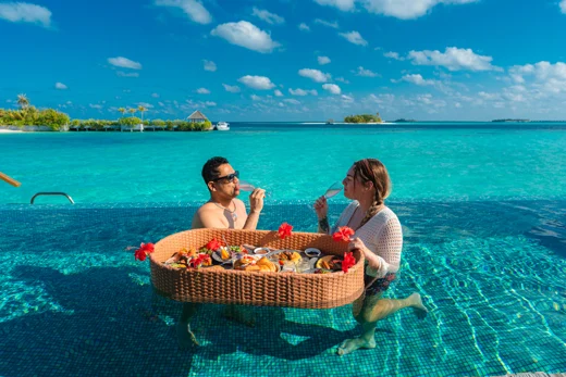 A floating breakfast at an overwater villa at OUTRIGGER Maldives Maafushivaru